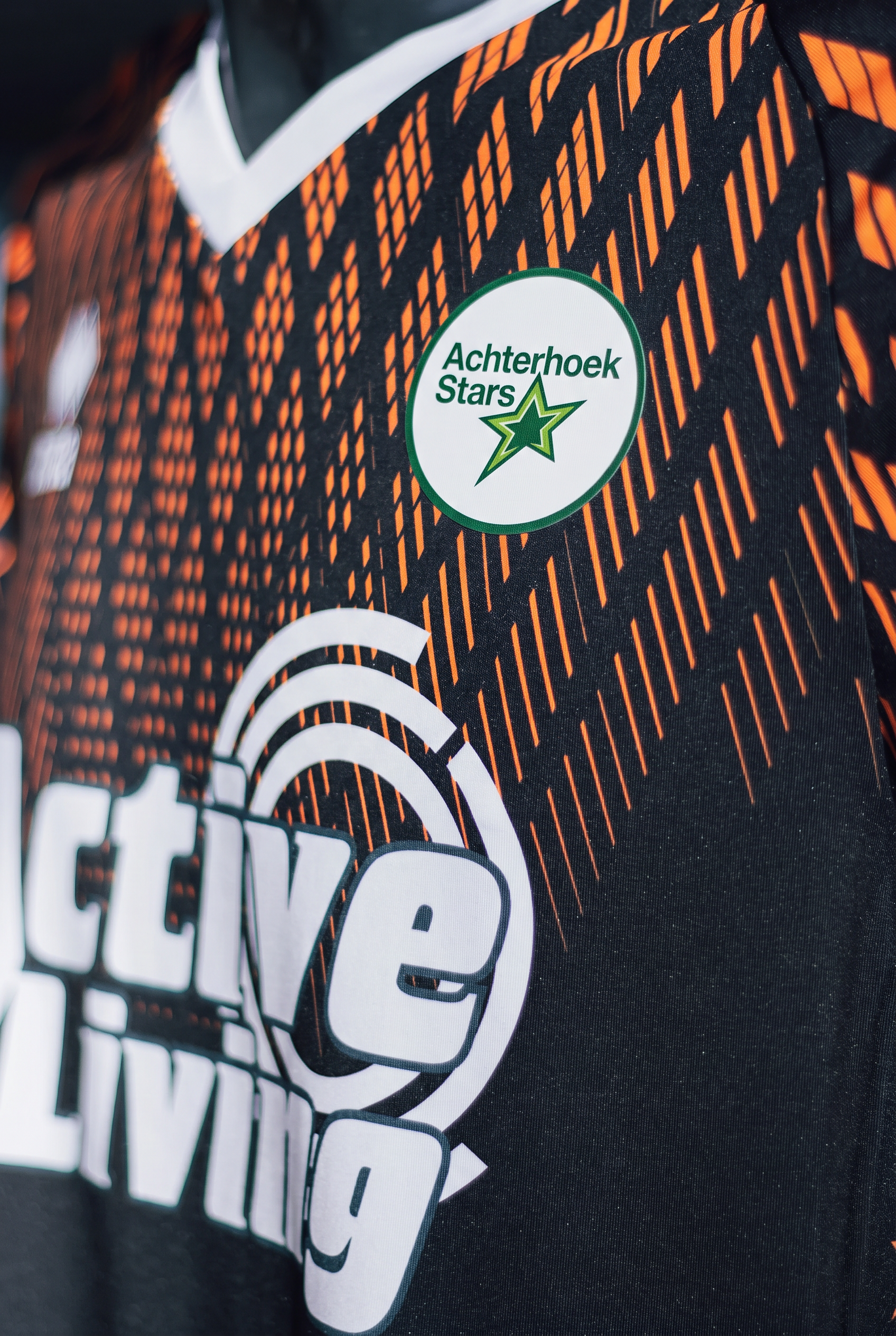 Wedstrijdshirt van Orion Stars met het Achterhoek Stars-logo als badge op de borst